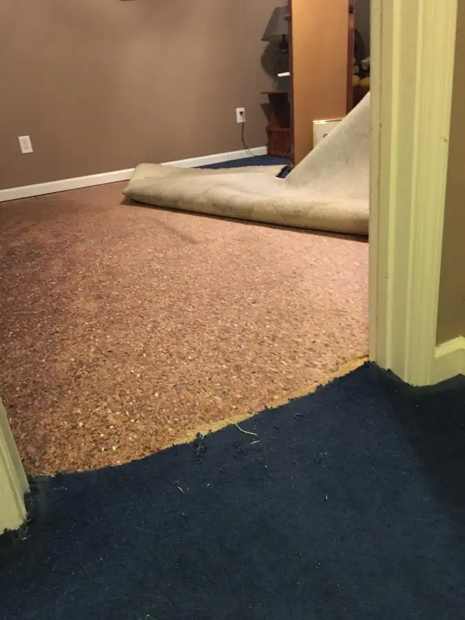 Carpet pad removal revealing water damage during Drying & Dehumidification in Oak Creek